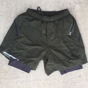 Green and black lululemon running shorts.